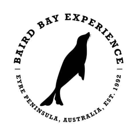 Logo of Baird Bay Experience featuring a silhouette of a seal in the center. Text reads: "Baird Bay Experience, Eyre Peninsula, Australia, Est. 1992". Certified sustainable tour.