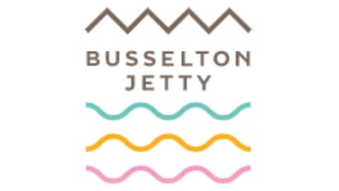 Logo with zigzag and wavy lines above and below the text "Busselton Jetty," beautifully capturing the essence of Busselton.