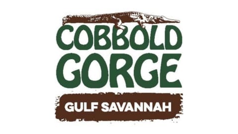 Logo for Cobbold Gorge, featuring a stylized illustration of a crocodile above the text "Cobbold Gorge" and "Gulf Savannah" below, emphasizing sustainable tourism and nature exploration.