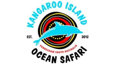 Logo for Kangaroo Island Ocean Safari, featuring a blue dolphin silhouette in front of a stylized sunburst. Text includes "Kangaroo Island Ocean Safari," "Penneshaw South Australia," and "Est. 2012." Perfect for those seeking nature tours and unique accommodation experiences.