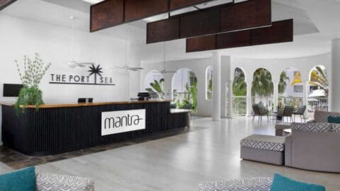 A large white lobby with dark wooden features.