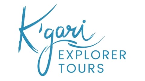 Blue logo with the text "K'gari Explorer Tours" in a cursive and sans-serif font style, highlighting their commitment to ecotourism.