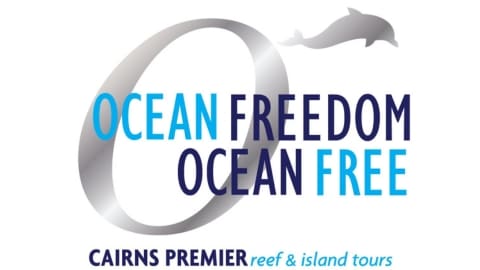 Ocean Freedom and Ocean Free logo featuring a grey dolphin, promoting Cairns Premier Reef & Island Tours.