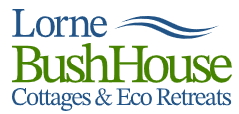 Lorne Bush House Cottages & Eco Retreats logo featuring blue and green text alongside a wave graphic.